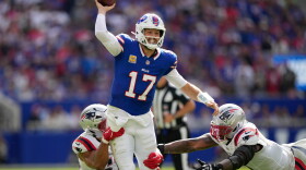 Buffalo Bills quarterback Josh Allen (17) passes against New England Patriots center Jared Wilson (55) and defensive end Dre'mont Jones (5) during an NFL football game in Orchard Park, N.Y., Sunday, Oct. 4, 2026.