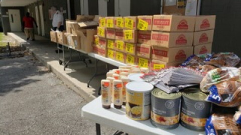 The Salvation Army hosted a drive-thru food distribution, though sunscreen was also included.