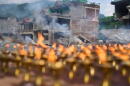 Lamps burn as Buddhist monks perform rituals and prayers for victims of the recent flash floods in the Dhunge area of district Nuwakot, Nepal, Monday, Sept. 7, 2026. (Niranjan Shrestha/AP)