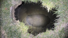 This Tuesday, Dec. 3, 2024. image provided by the Pennsylvania State Police shows the top of a sinkhole in the village of Marguerite, Pa., where rescuers were searching for a woman who disappeared.