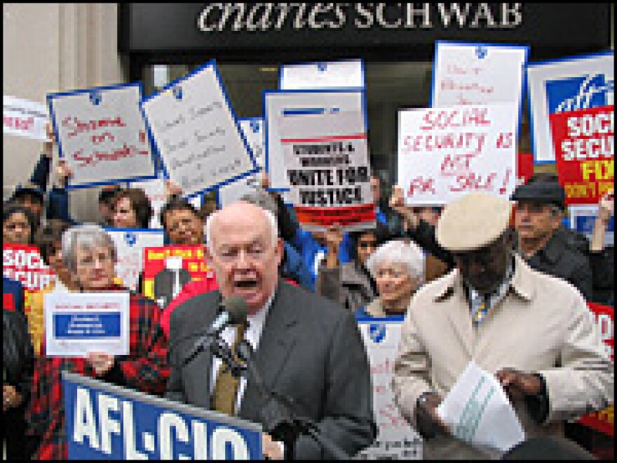 John Sweeney, head of the AFL-CIO, leads a crowd of union protesters outside the Washington offices of investment firm  Charles Schwab.