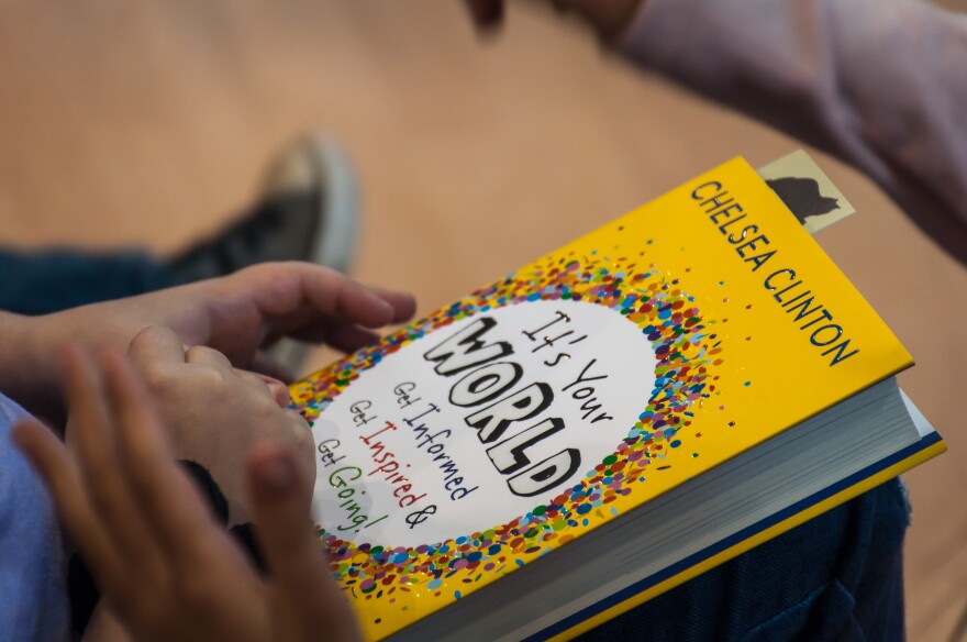 A student at Saul Mirowitz Jewish Community School holds a copy of Chelsea Clinton's book. April 7, 2017.