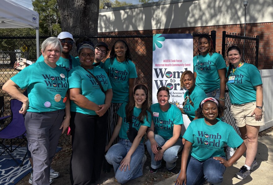 Members of the Access Task Force led by Dr. Adetola Louis-Jacques pose for a photo during a maternal health community event in Gainesville, Fla., Saturday, Feb. 22, 2026. Louis-Jacques thanked supporters, saying, “We’re grateful for every member of the task force, for every vendor, every sponsor, every donor. We couldn’t have done this without you.” (Annaleis Holz/WUFT)