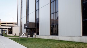 The exterior of a government building, a sign identifies it as the health department