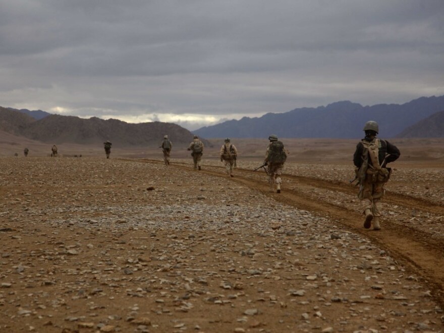 <p>Marines of the 3rd Battalion, 5th Regiment conduct a search operation in Sangin district, Afghanistan, on Feb.18, 2011. Roadside bombs were a constant threat on such patrols.</p>