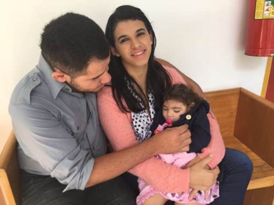 Maria Carolina Silva Flor and Joselito Alves dos Santos with their 18-month-old daughter, Maria Gabriela Silva Alves. The baby was born with Zika syndrome.