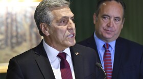 Lou Barletta speaks at a news conference where he accepted the endorsement of a rival in Pennsylvania's crowded Republican primary for governor, Jake Corman, right, May 12, 2022, in Harrisburg, Pa. Corman's endorsement comes as GOP leaders warn that leading Republican primary candidate Doug Mastriano is too far right to win in a general election. 