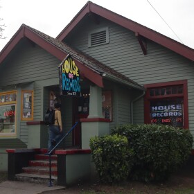 A customer walks into Eugene's House of Records on April 7, 2026. The business has called this converted house its home since 1973.