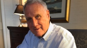 Jon Kyl wearing a blue and white striped shirt