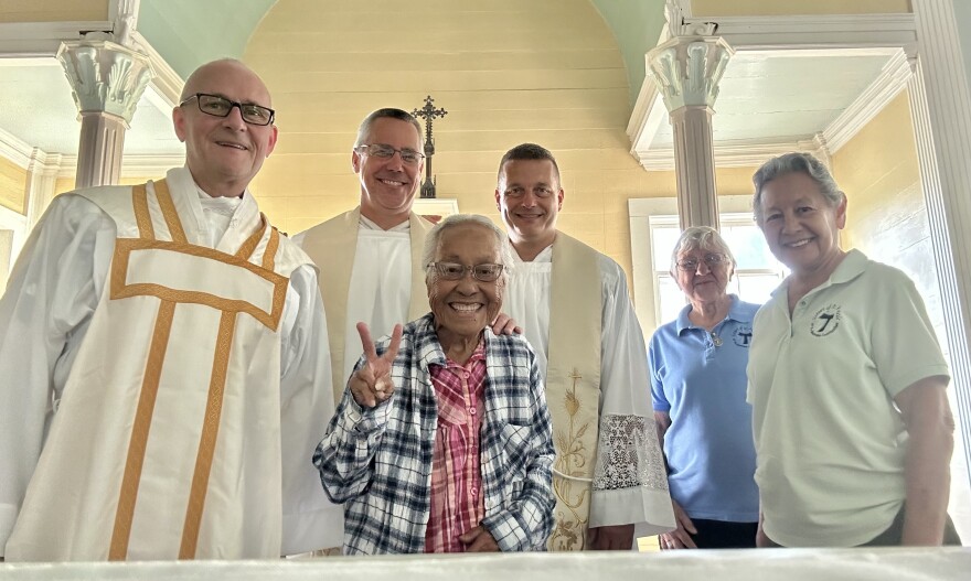 Meli Watanuki, center, with Sisters Barbara Jean Wajda and Alicia Damien Lau, with visiting priests at a special liturgy at St. Philomena Church in Kalaupapa.
