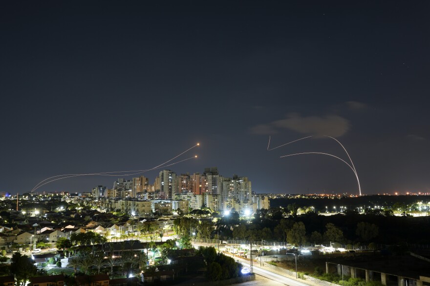 Israel's Iron Dome anti-missile system fires to intercept rockets launched from the Gaza Strip towards Israel just before a cease-fire between Palestinians and Israel takes effect, in Ashkelon, southern Israel, Aug. 7.