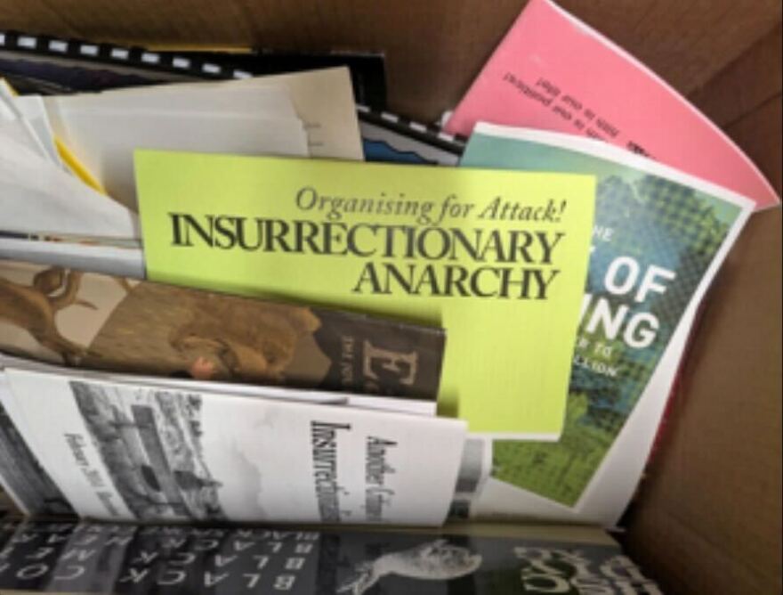 One of the defendants was charged with evidence tampering and conspiracy to tamper with evidence for attempting to get rid of documents related to the shooting at the Prairieland Detention Center. Court records say the box the defendant left at a Denton apartment contained antigovernment propaganda.