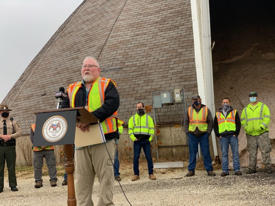 Matthew Vitner, bureau chief of operations for Illinois Department of Transportation District 4, stands in front of a Peoria County Highway Department salt dome.