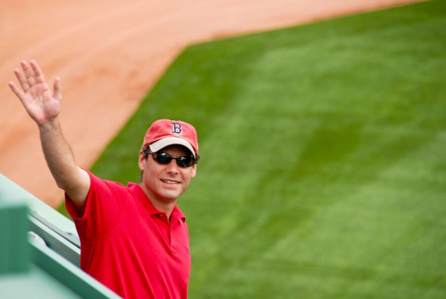  Mitch waving to the camera on a trip to Fenway Park with VPR listeners in 2008