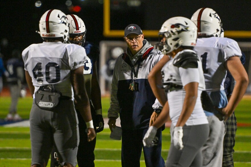 Lackawanna College Head Football Coach Mark Duda talks with players during practice on Wednesday.