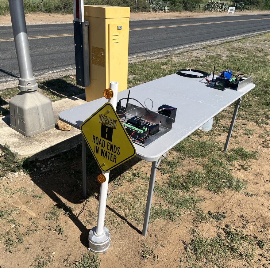 A display of the technology used in the operation of automated gate arms for low water crossings during a flood in Bexar County.