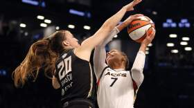 Alysha Clark #7 of the Las Vegas Aces drives to the basket against Sabrina Ionescu #20 of the New York Liberty in the fourth quarter during Game Four of the 2023 WNBA Finals at Barclays Center on Oct. 18, 2023 in New York City. (Sarah Stier/Getty Images)