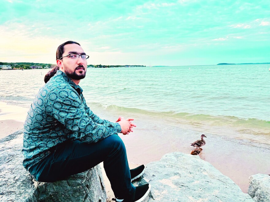 Ehsan Sahab, who works in Munson Hospital’s radiology unit, left Afghanistan when the Taliban seized power in 2021. He and his radiant family exude warmth and infectuous smiles. (Photo: Jacob Wheeler / Glen Arbor Sun)