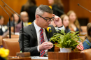 Oregon state Sen. Anthony Broadman at his desk on floor of the Oregon State Legislature.
