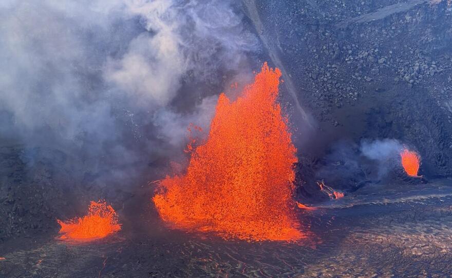 A telephoto view of lava fountains erupting within Kīlauea summit caldera the afternoon of Dec. 24, 2024.
