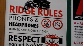 At Pleasure Ridge Park High School in Louisville, there are signs hanging on classroom walls and in the hallways reminding students that they are not allowed to have their phones out.