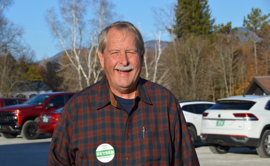 A man stands in a parking lot