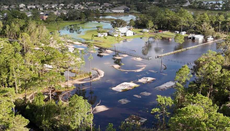 JC Figueredo's 12 acres look resemble lake land after Hurricane Milton. Behind his property, standing at several feet of elevation, is the DeLand neighborhood of Sawyer's Landing. That community did not experience intense flooding during the storm. Figueredo said that's because all their water flowed down to his land.