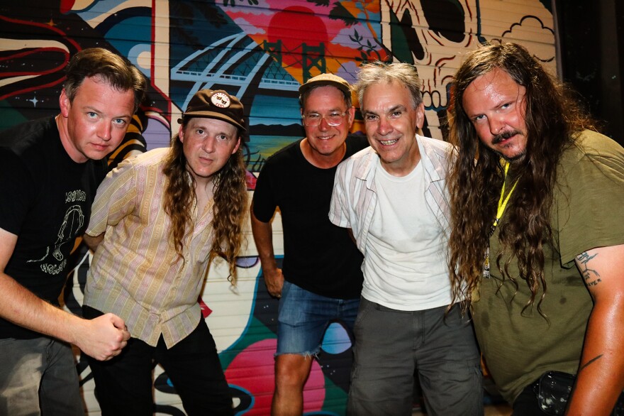 Chad Gooch (guitar), Dennis Hockaday (drums), Patrick Stolley (bass), Skip Greer (lead singer) and Jamie Warren (guitar) are the members of the Quad Cities supergroup Running Man.