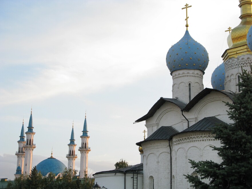 The domes of a Russian Orthodox church (right) share the skyline of Kazan, Tatarstan's capital, with the minarets of a Muslim mosque, a reminder of the city's history of peaceful coexistence between Christians and Muslims.