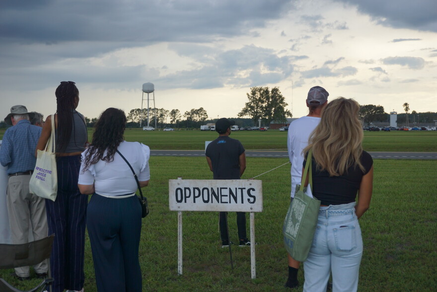 Protestors against the execution of Daniel Conahan observe a moment of silence outside Florida State Prison. (Alexa Ryan/WUFT News)