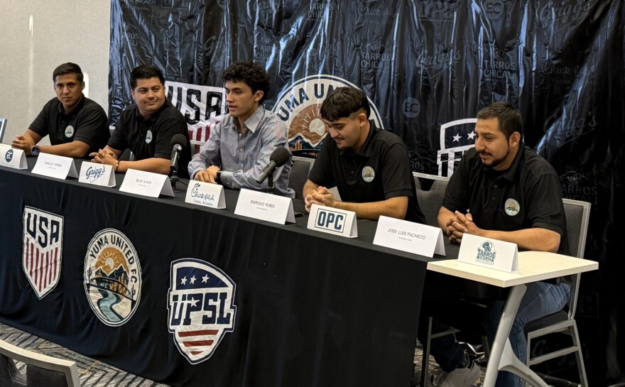 Yuma United FC club president Blas Gasca, center, speaks to reporters alongside the team's coaching staff at a press conference in Yuma on Friday, May 1, 2026.