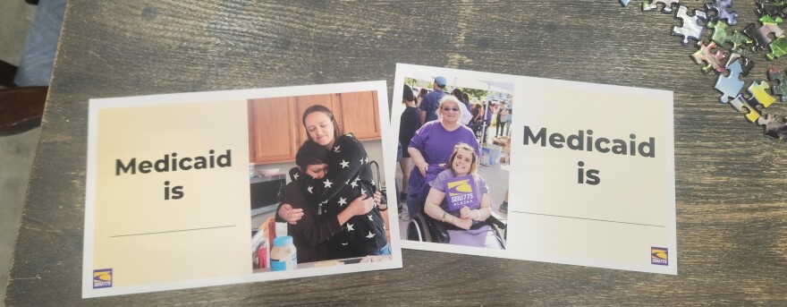 Flyers from SEIU 775 at a postcard-signing event in Homer invite participants to share what Medicaid means to them on Thursday, Mar. 20, 2025 in Homer, Alaska.