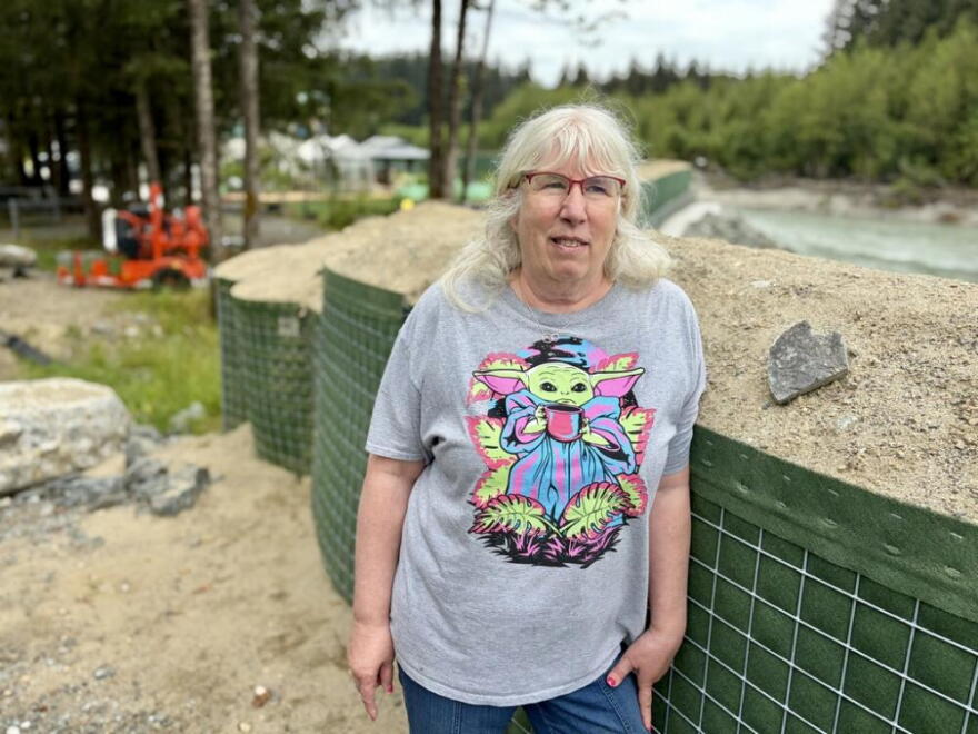 Flood barriers have gone up around Juneau resident Ann Lind’s home, which backs up against the Mendenhall River. (Peter O’Dowd/Here & Now)