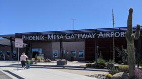 Building with silver letter sign that reads Phoenix Mesa Gateway Airport