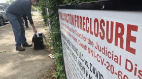 A lawyer appointed by the court prepares to auction off a foreclosed home in New Haven.