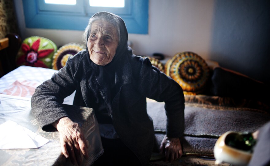 Efstratia Mavrapidou, 89, at her home in the village of Skala Sikaminias, Lesbos. "When my mother arrived here in 1922, there were five impoverished farmers here," she says. "She and her babies slept in sheds where olives were stored."
