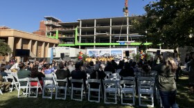 Students in the OKCPS Children’s Choir sing as the final steel beam is lifted overhead for the construction of a new pediatric behavioral health center at OU Health.