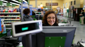 Wal-Mart employee Blanca Mojita rings up a customer's purchases at a Wal-Mart store on Feb. 19, 2015 in Miami. (Joe Raedle/Getty Images)