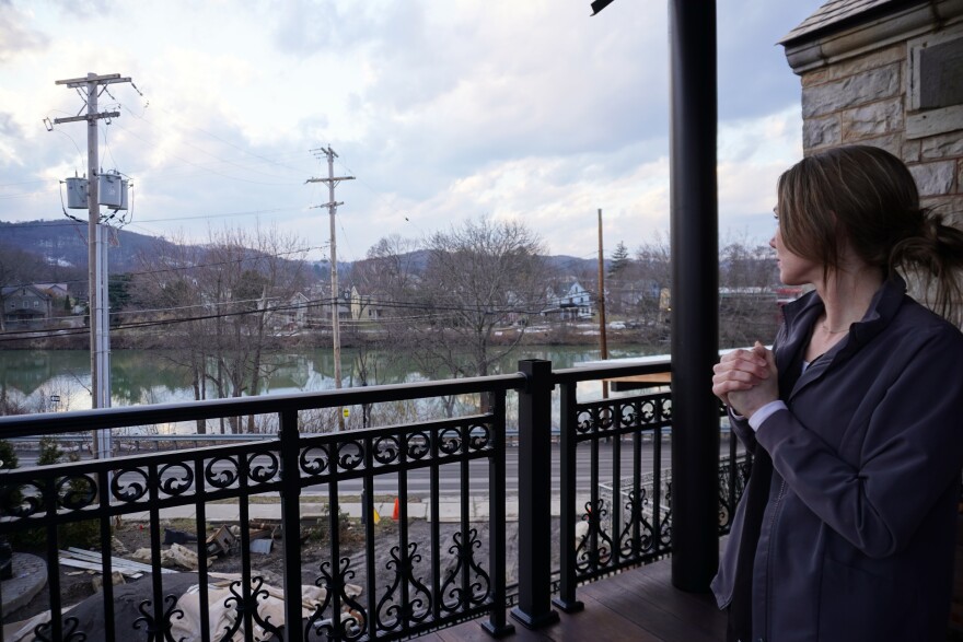 Ashley Bell looks out at the West Branch of the Susquehanna River from one of the outdoor decks at The Rock on the River. This deck is one of two outdoor dining locations.