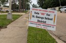 A sign outside the East Baton Rouge Parish School System office opposes Amendment 2, which would create a separate school district for the new city of St. George, on May 11, 2026.
