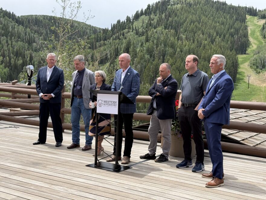 Governors Brad Little of Idaho, Mark Gordon of Wyoming, Michelle Lujan Grisham of New Mexico, Spencer Cox of Utah, Josh Green of Hawaii, Jared Polis of Colorado and Joe Lombardo of Nevada stand together during a news conference in Park City, Utah on June 30, 2026.