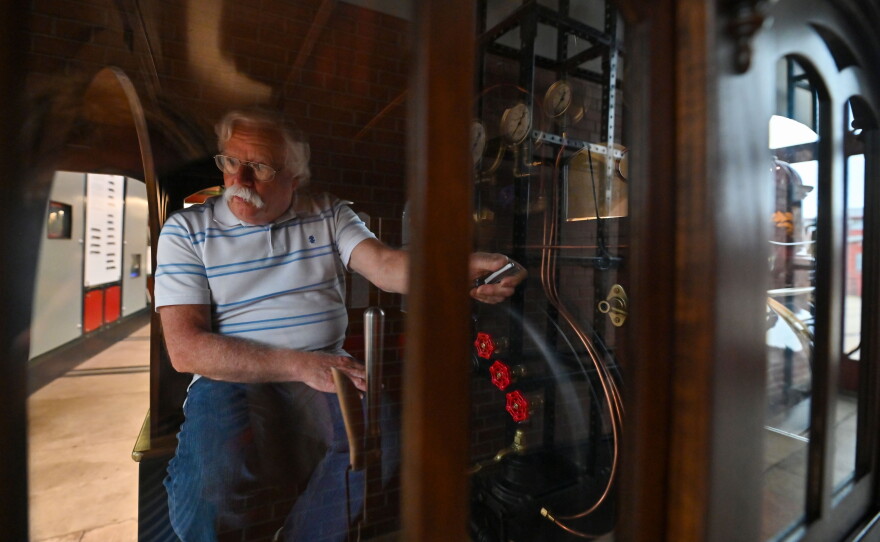 Dan Hryhorcoff drives the train from the cab of the half-scale replica of the Union Pacific 119.