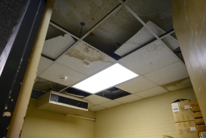 Signs of an aging school are evident at Bonham Middle School in Odessa. A decaying ceiling and leaking air conditioner in a room used for storage.