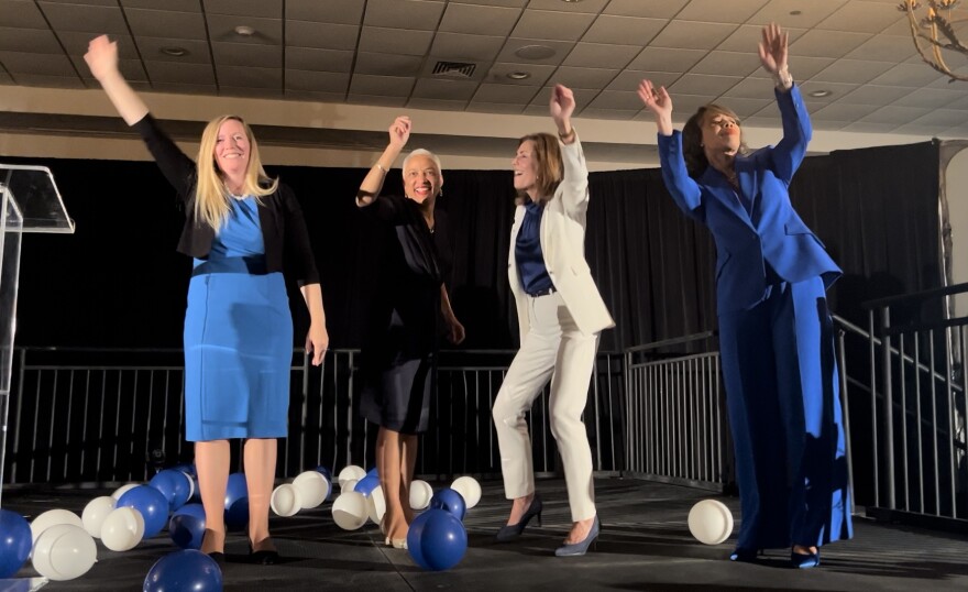 From left to right: State Treasurer elect Colleen Davis, State Auditor Elect Lydia York, reelected Attorney General Kathy Jennings, and reelected Representative Lisa Blunt-Rochester, celebrate their wins together on stage at the Democratic Election Night Headquarters at the DoubleTree in Wilmington.