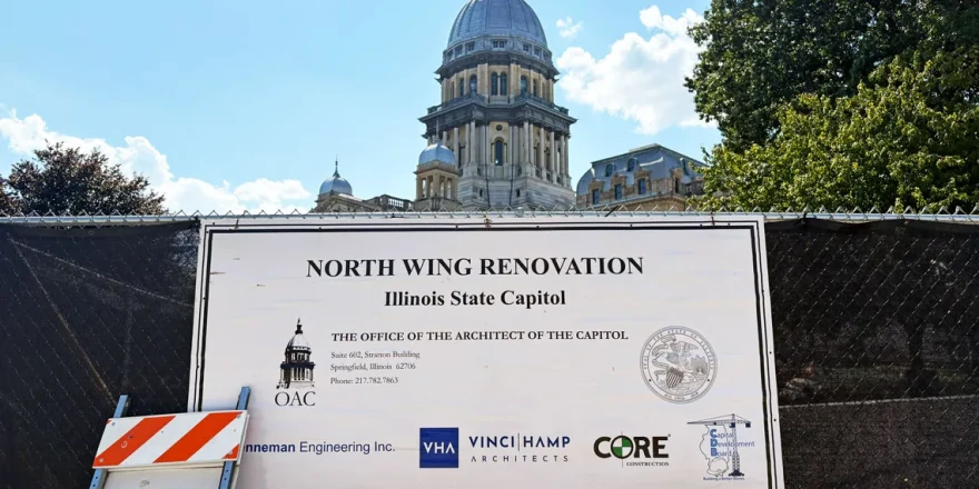 A sign shows the parties involved in construction on the north wing of the Illinois State Capitol.
