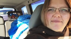 Tricia Olson takes a selfie of herself and her son Augustus, or Gus, who sits in his car seat. Olson took three weeks of unpaid leave from her job at a towing company in Rock Springs, Wyo., after giving birth.