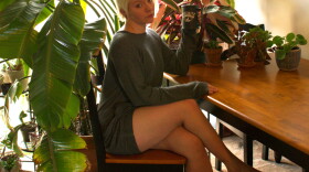 Amber Wacker sits amidst her plants, "savoring the last dregs of Yosemite."