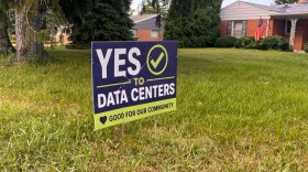 A yard sign supporting data centers