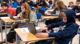 Justin Johnson, an eighth grader at Bridge Creek Middle School in Blanchard, works on an essay during writing class on Nov. 21, 2019. Bridge Creek has four-day school weeks. 