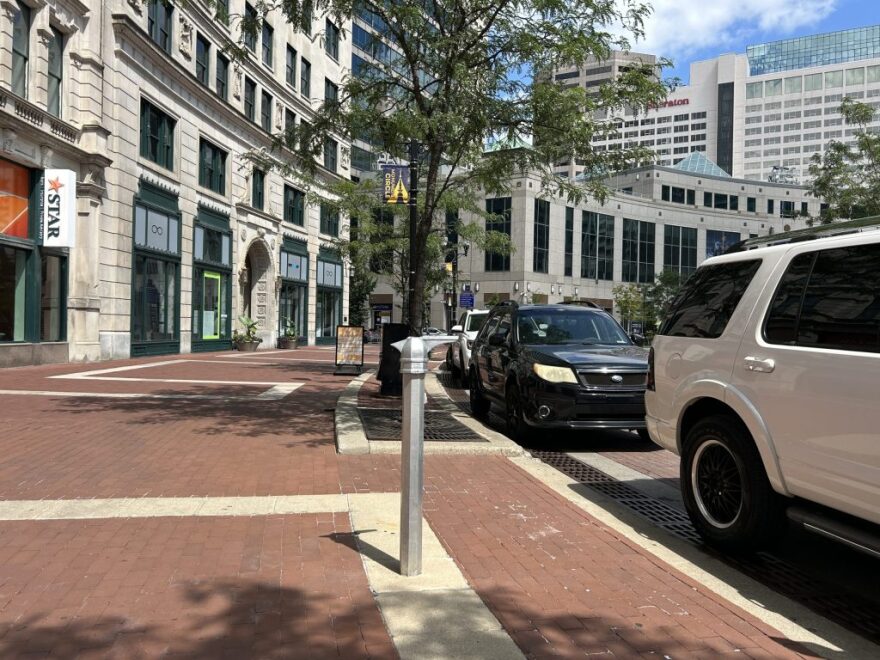 Video footage shows individuals kicking the Indy Pride historical marker on Monument Circle around 12:45 a.m. July 16. They cracked a piece of the cast metal panel and dented the outer raised frame. The post remains intact on the sidewalk. July 23, 2026, at Monument Circle in Indianapolis.